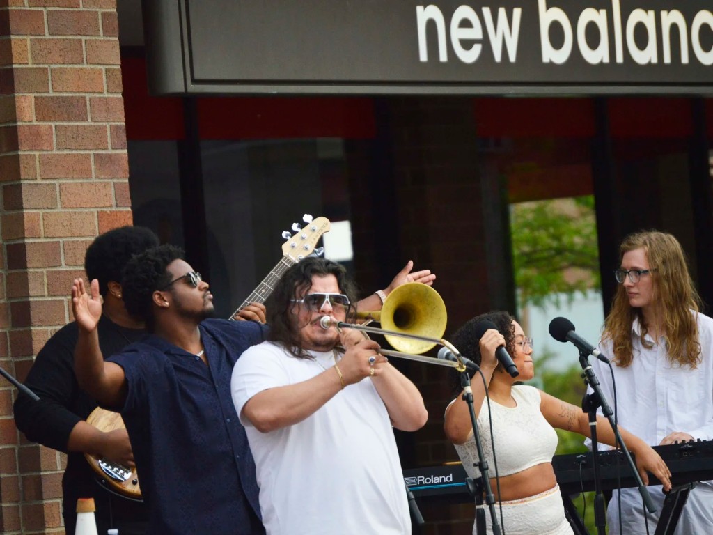 Live band performing at a Highland Park street festival near Raritan Avenue